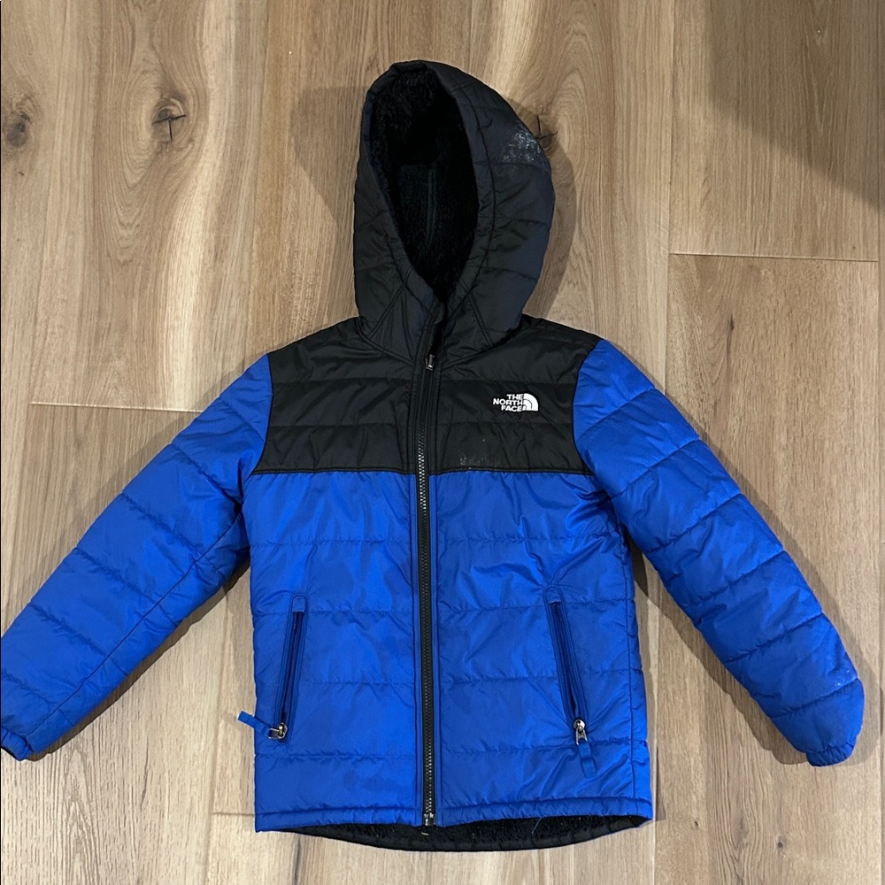 The North Face Black and Blue Puffer Jacket Youth Reversible Size Small (7/8)